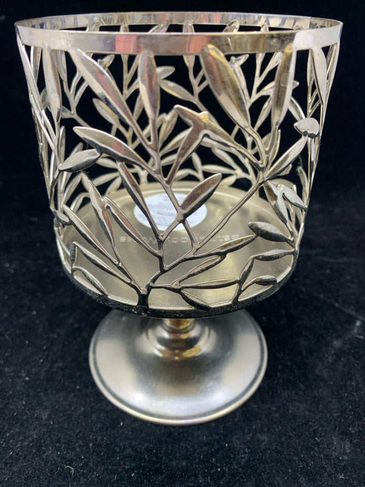 FOOTED SILVER METAL CANDLE SLEEVE LEAF DETAIL.