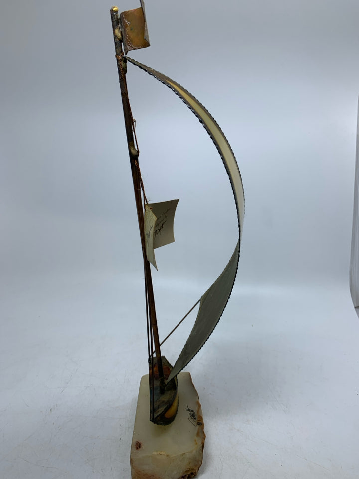 VTG BRASS SAIL BOAT ON ROCK SLAB SIGNED DEMOTT W/ TAGS.