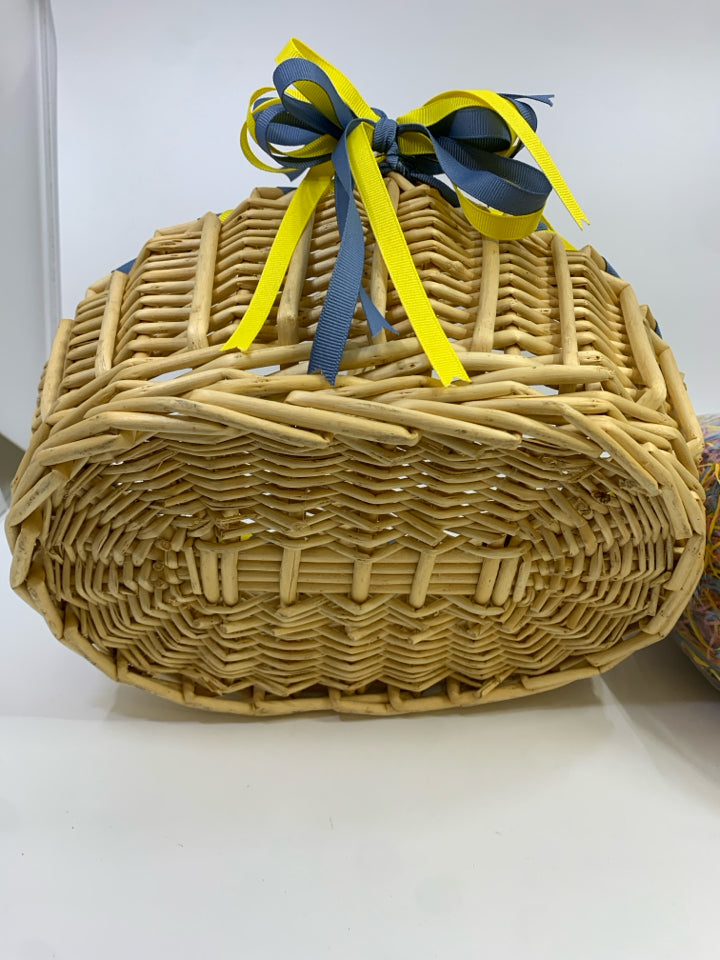 WOVEN EASTER BASKET W/BLUE AND YELLOW RIBBON FAUX GRASS.