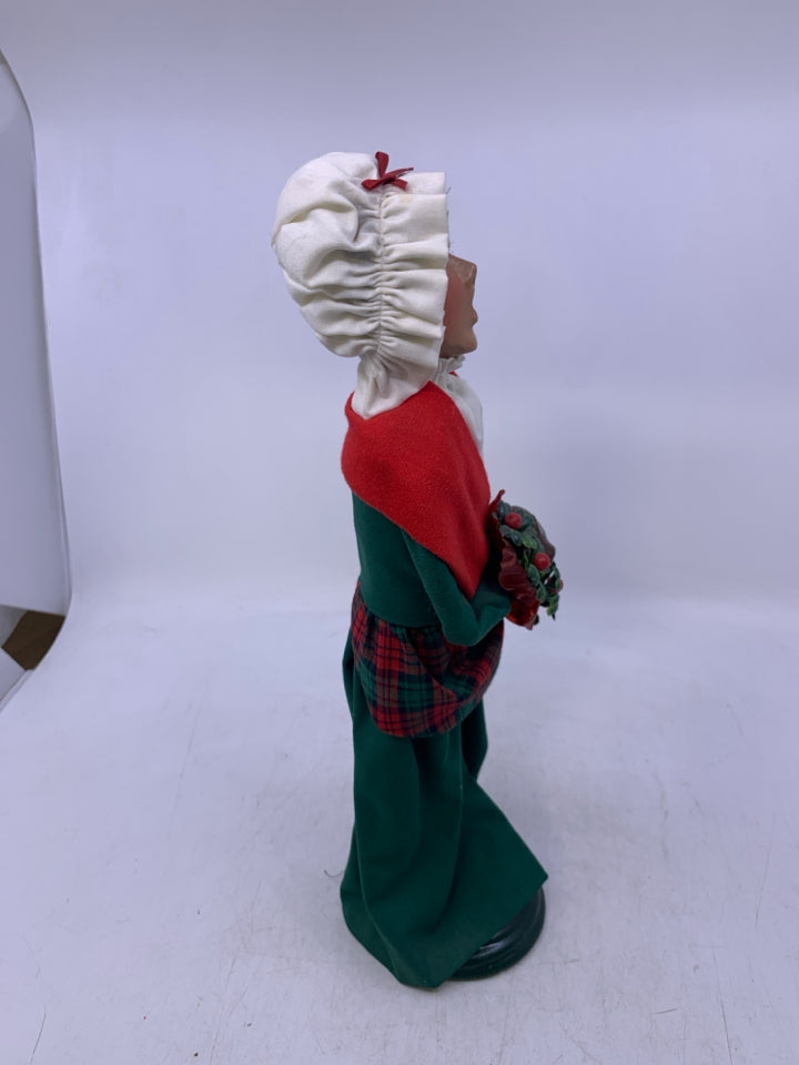 1993 BYERS' CHOICE WOMAN CAROLER WITH FLOWERS.