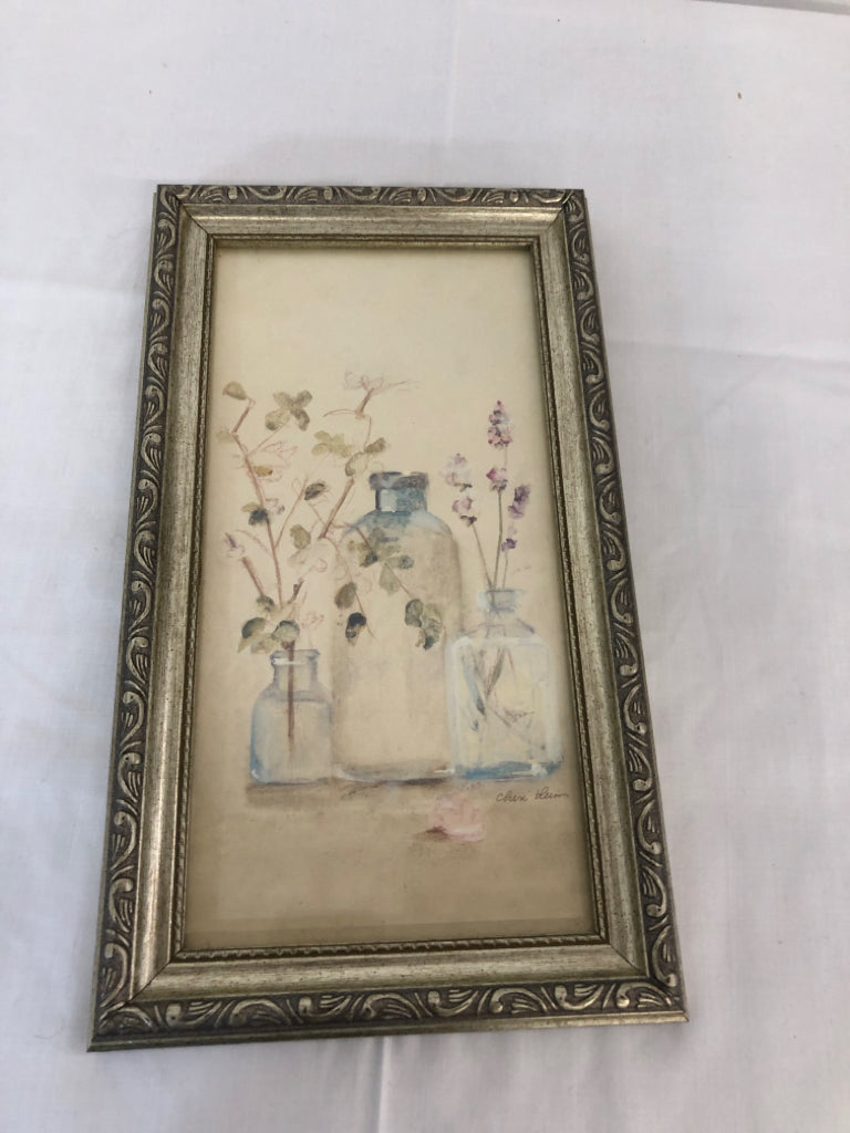 FLORAL IN BOTTLE VASE IN SILVER FRAME WALL HANGING.