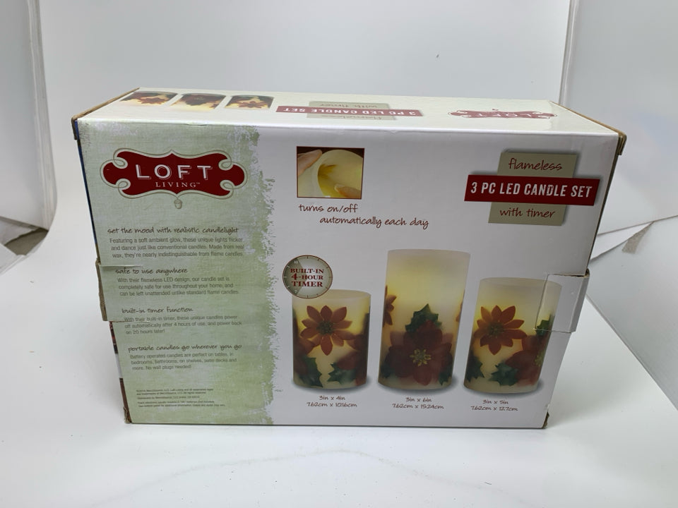 IN BOX 3 POINSETTIA LET CANDLE SET.