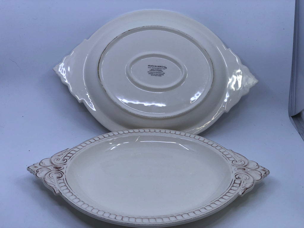 2 OVAL CREAM SCROLL DESIGN PLATTERS.