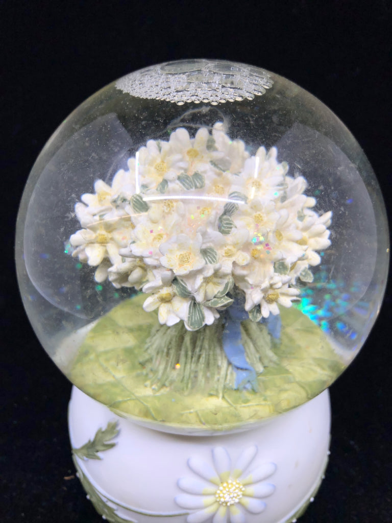 MUSICAL SNOW GLOBE WITH WHITE BOUQUET OF FLOWERS.