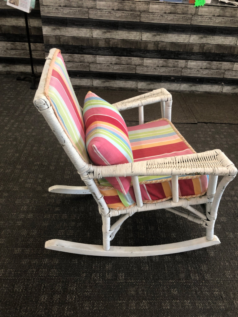 VTG WHITE WICKER ROCKING CHAIR W/ COLORFUL UPHOLSTERED BACK/CUSHION.