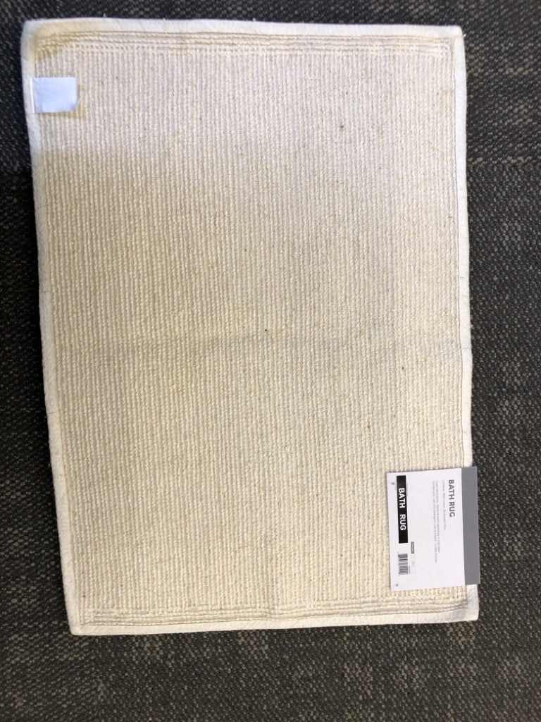 NIP CREAM BATH RUG.