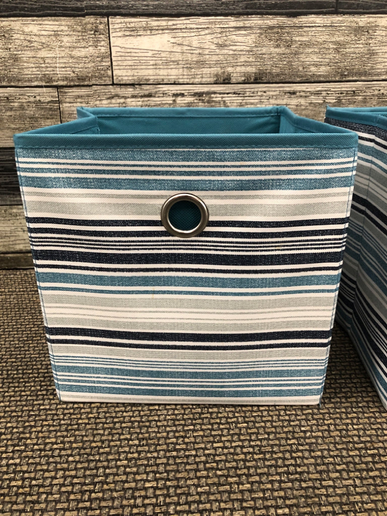 2 BLUE/TEAL FABRIC STORAGE BOXES.