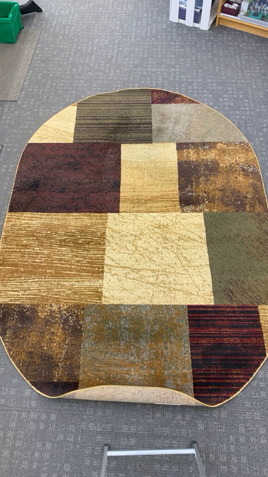 OVAL BROWN SQUARE PATTERN AREA RUG.