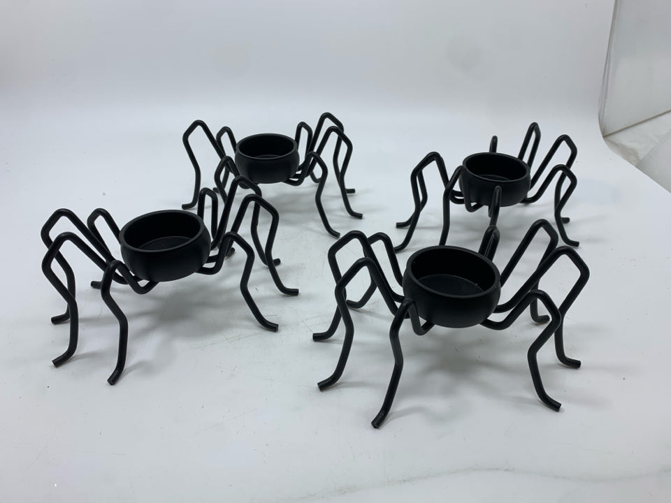 4 BLACK SPIDER TEA LIGHT HOLDERS.