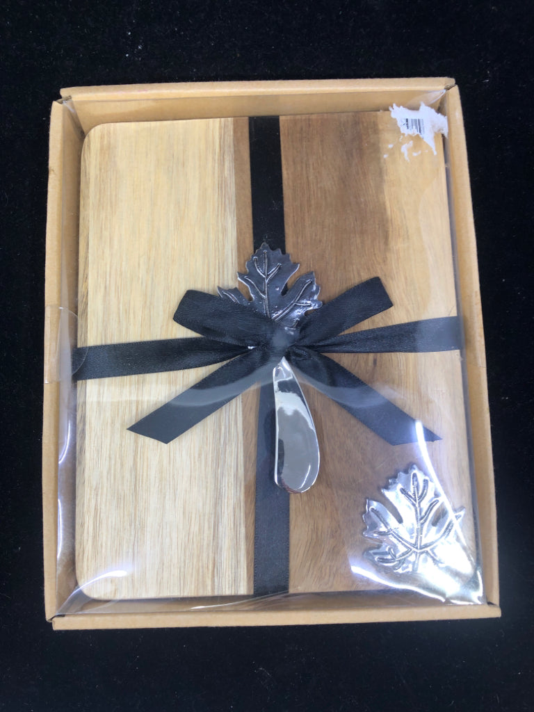 NIB MAPLE LEAF CUTTING BOARD.