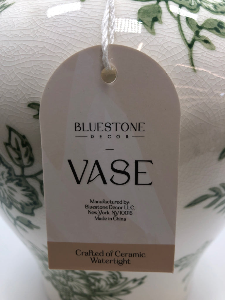 GREEN FLORAL CERAMIC VASE.