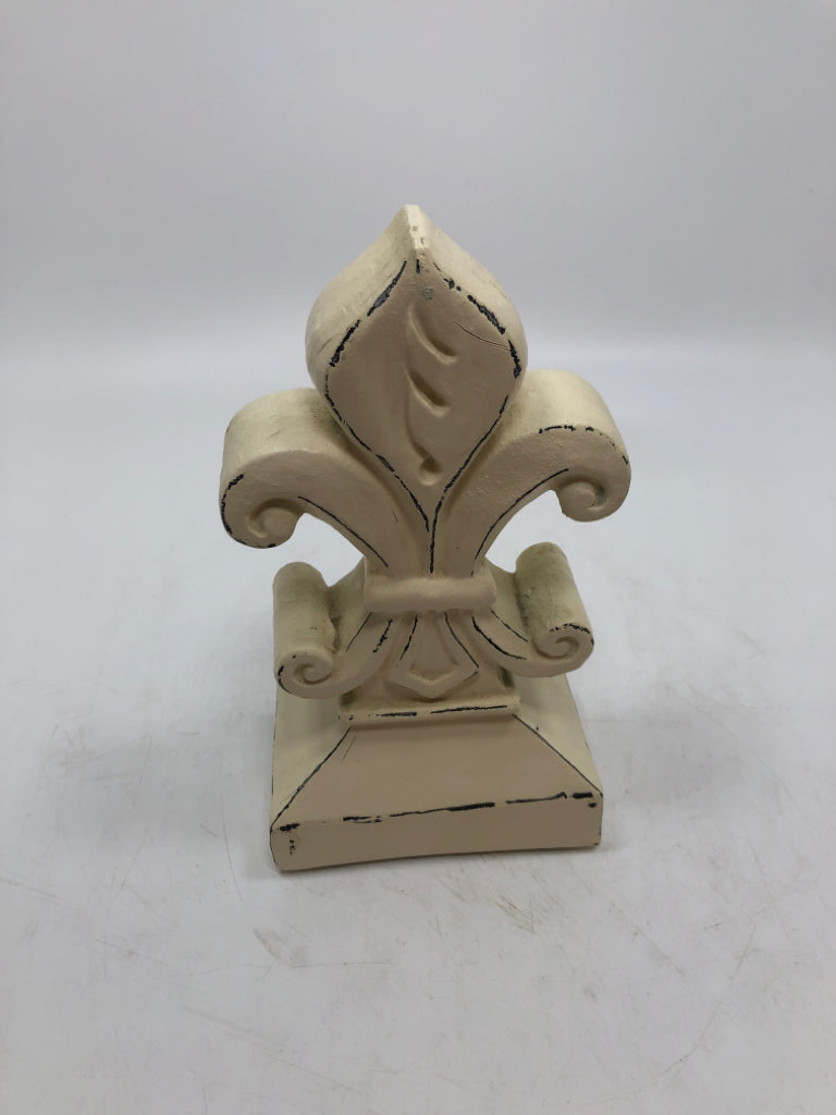 WHITE FLEUR-DE-LIS FIGURINE.