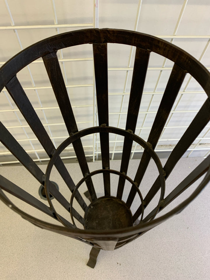 HEAVY METAL FOOTED UMBRELLA HOLDER.