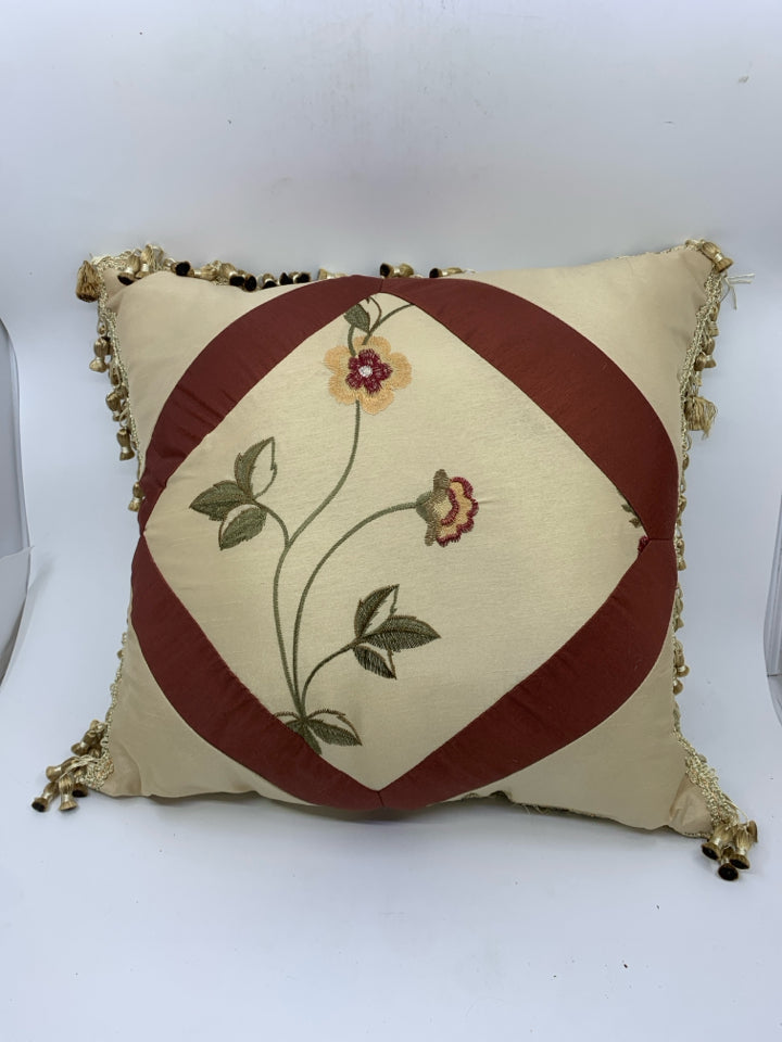 TAN W RED FLOWERS AND TASSELS PILLOW.