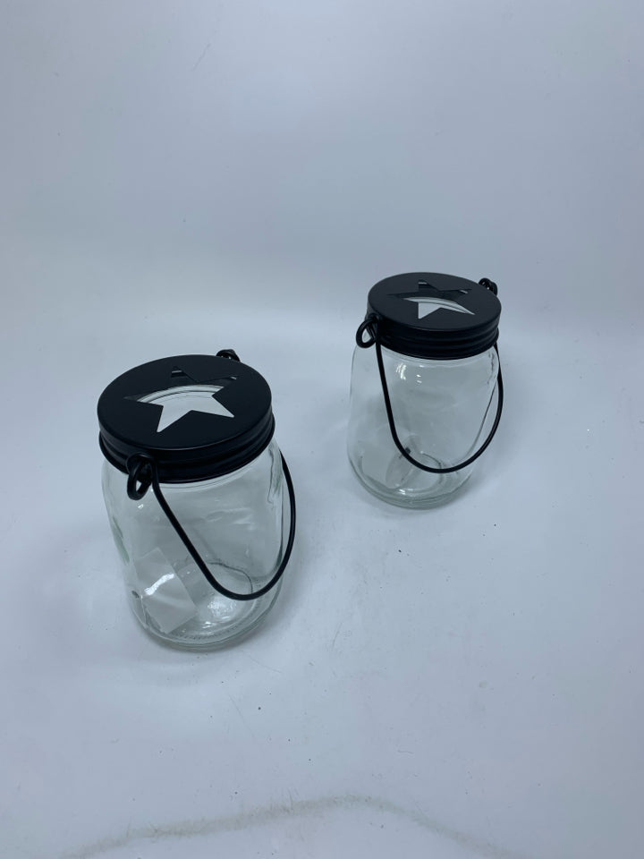 2 GLASS MASON JAYS W/ STAR CUT OUT CAP LANTERN.