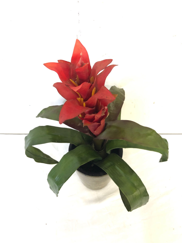 FAUX RED GUZMANIA IN BROWN PLANTER.