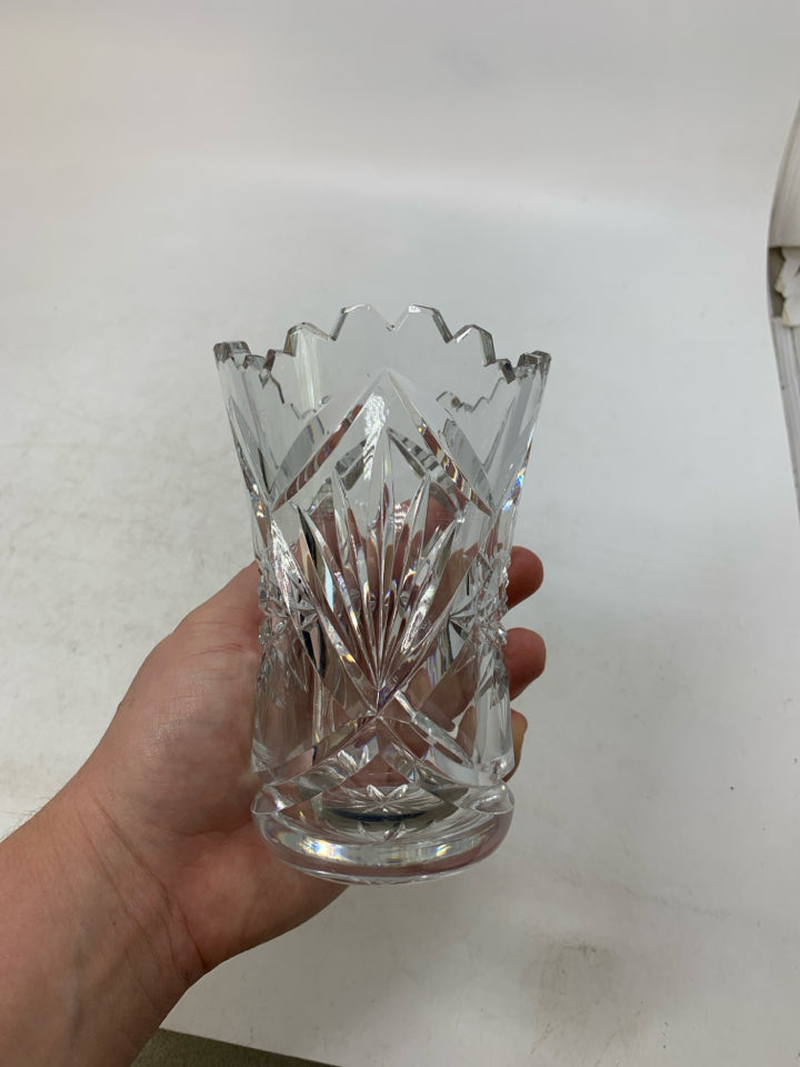 HEAVY BOTTOM STAR PATTERN CRYSTAL VASE W/ UNEVEN TOP.