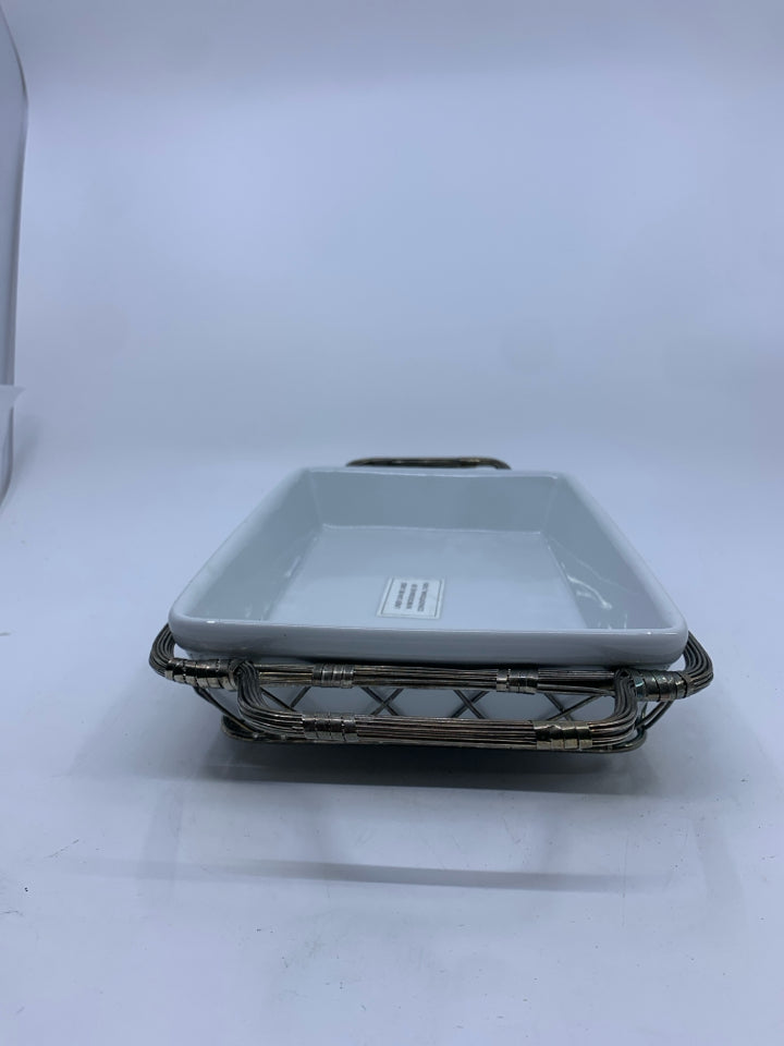 WHITE RECTANGLE SERVER IN SILVER METAL TRAY.