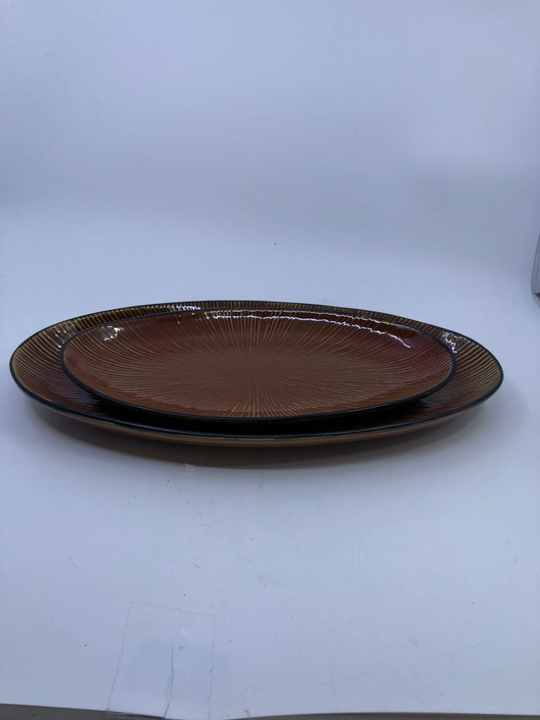 2 BROWN OVAL CERAMIC SERVING PLATES.