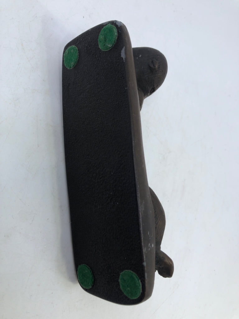 BROWN OTTER HOLDING BABY SWIMMING.