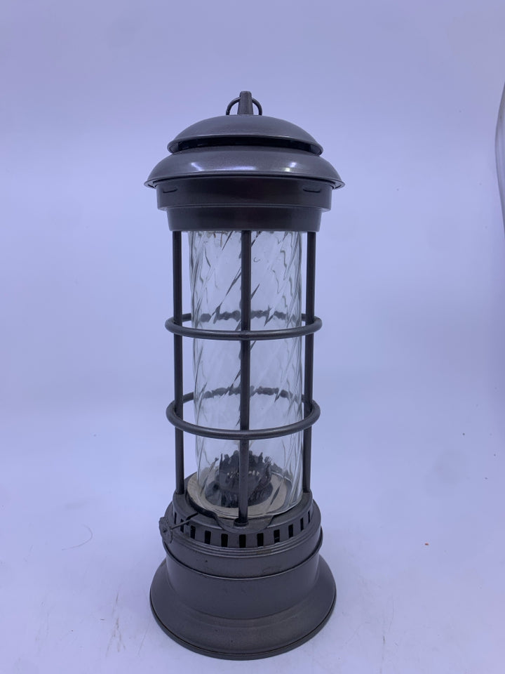 GREY METAL OIL LANTERN W/ GLASS PANE.