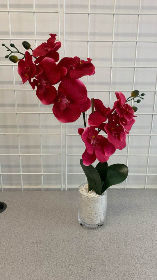 HOT PINK FAUX ORCHID IN RIBBED GLASS VASE.