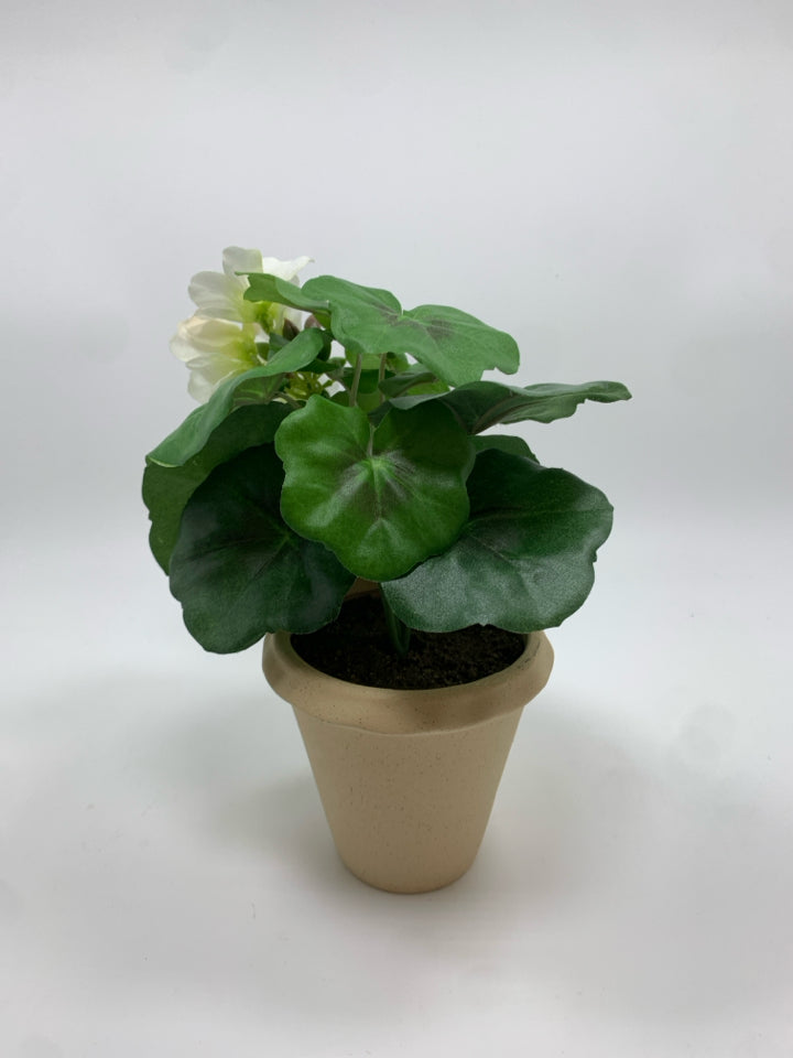 FAUX GERANIUM IN TAN POT.