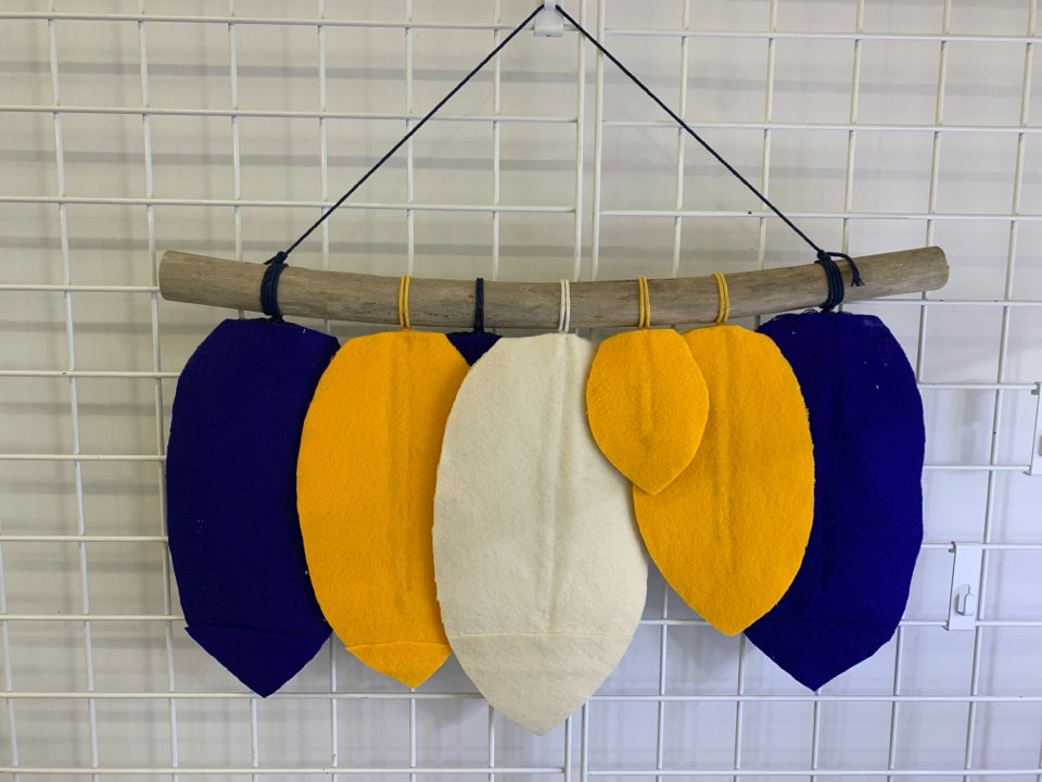 BLUE/YELLOW/WHITE HANGING FEATHERS ON STICK WALL ART.