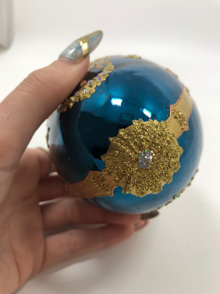 BLUE & GOLD EGG SHAPED ORNAMENT.
