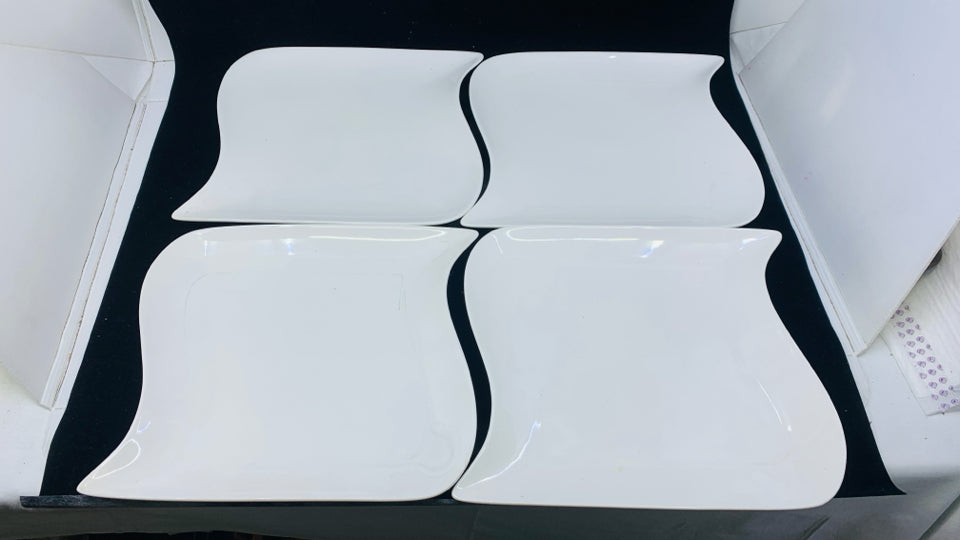 4 SQUARE WHITE DINNER PLATES.