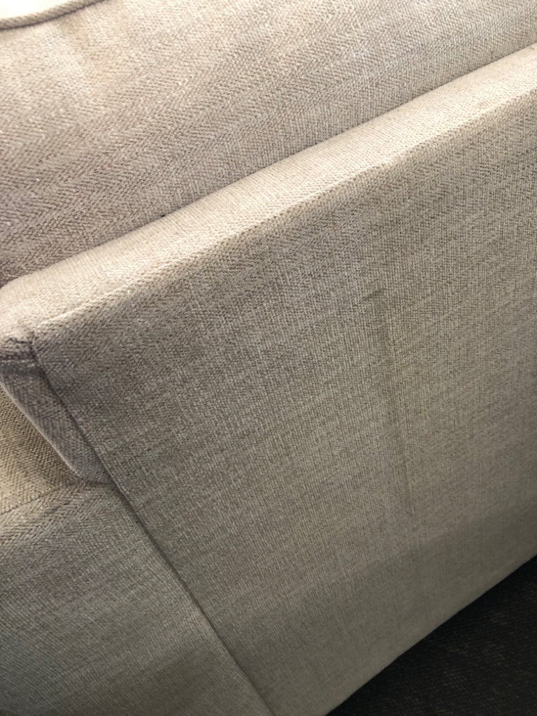 L-SHAPED CREAM COUCH.