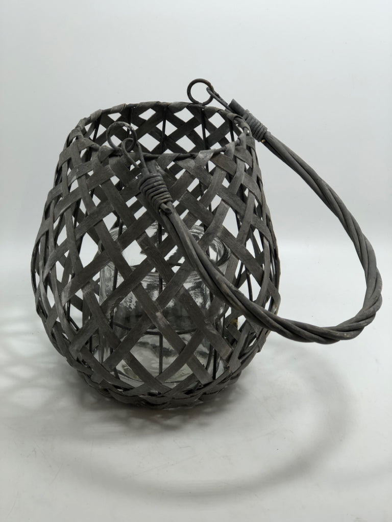 GRAY WOVEN CANDLE LANTERN.