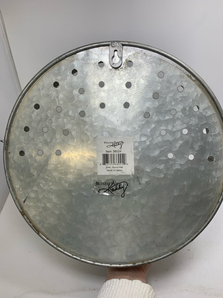 GALVANIZED PIERCED CIRCLE WALL HANGING W/ WOOD SHELF.