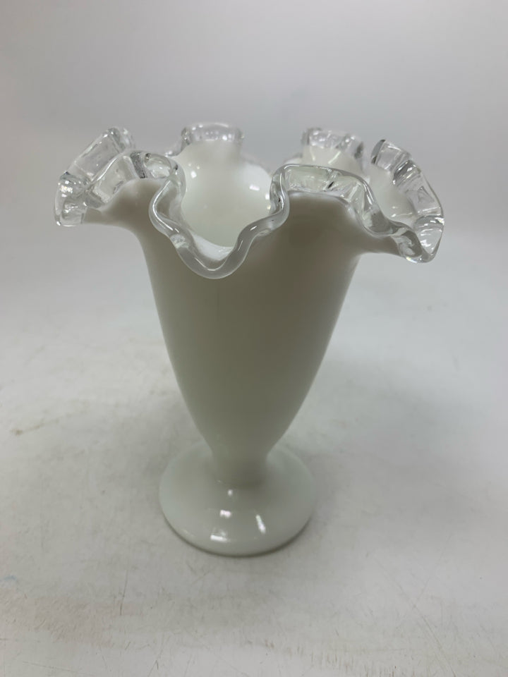 MILK GLASS FOOTED VASE W/ CLEAR RUFFLED EDGE.