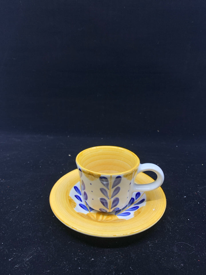 BLUE AND YELLOW FLORAL TEACUP AND SAUCER.