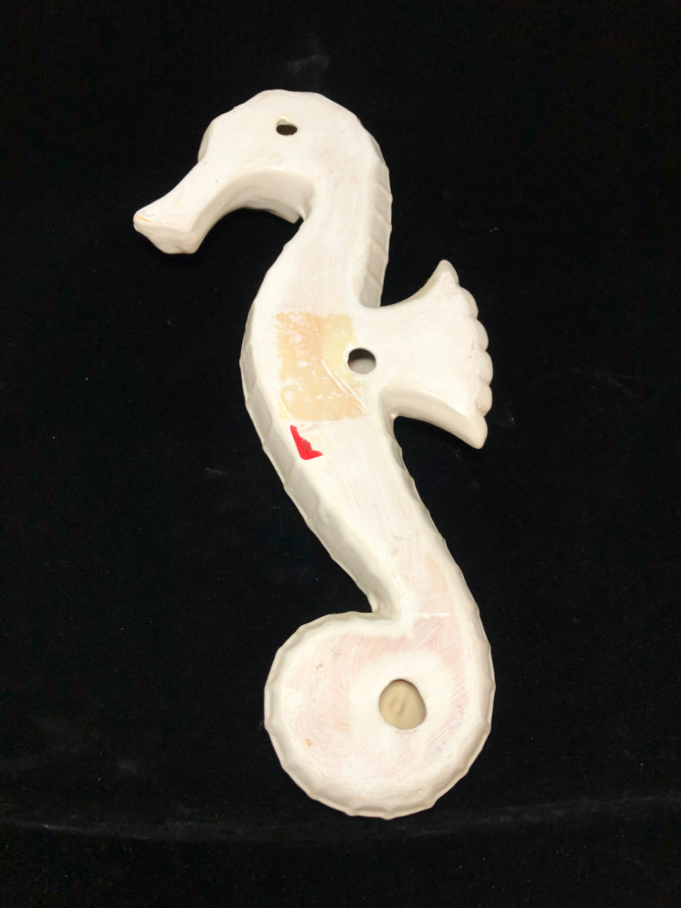 WHITE GLAZED CERAMIC SEAHORSE.