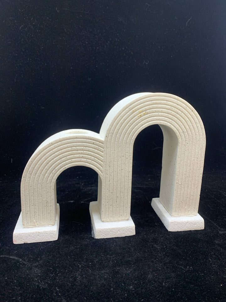 DOUBLE ARCHED CANDLE HOLDER.