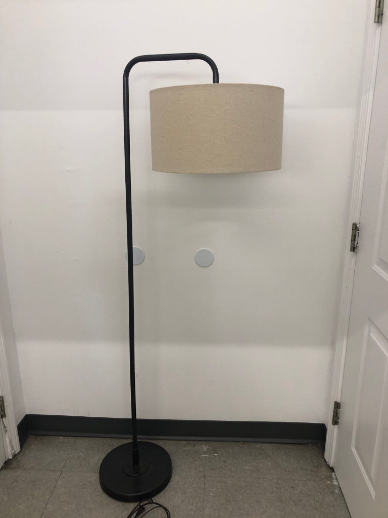 GREY BASE METAL FLOOR LAMP W/ CREAM SHADE.