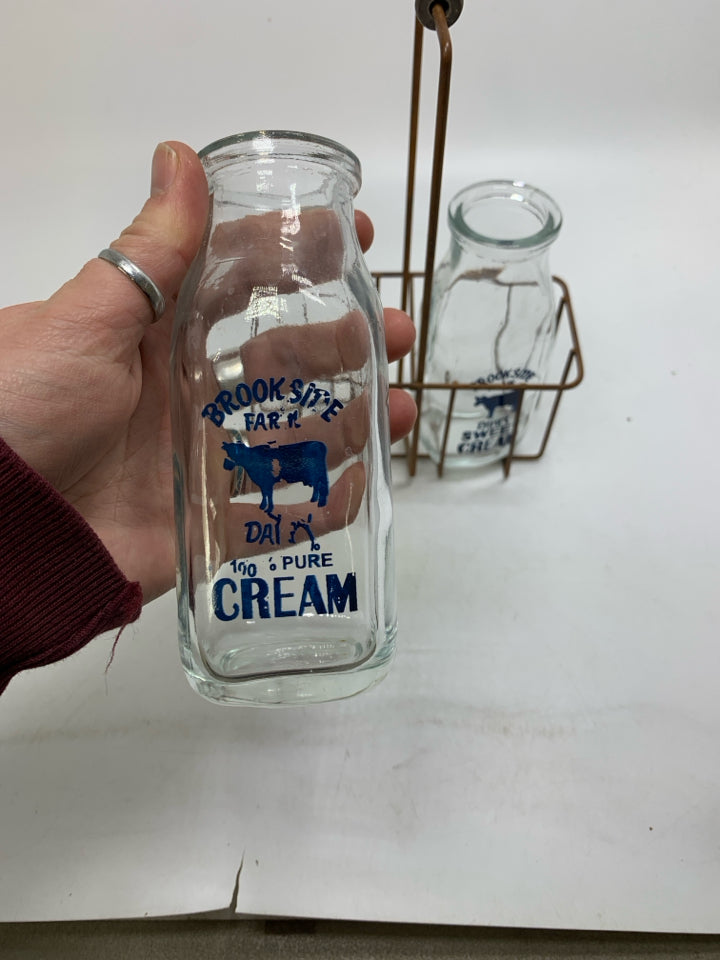METAL 2 SLOT CRATE W/ BROOKSIDE CREAM BOTTLES.