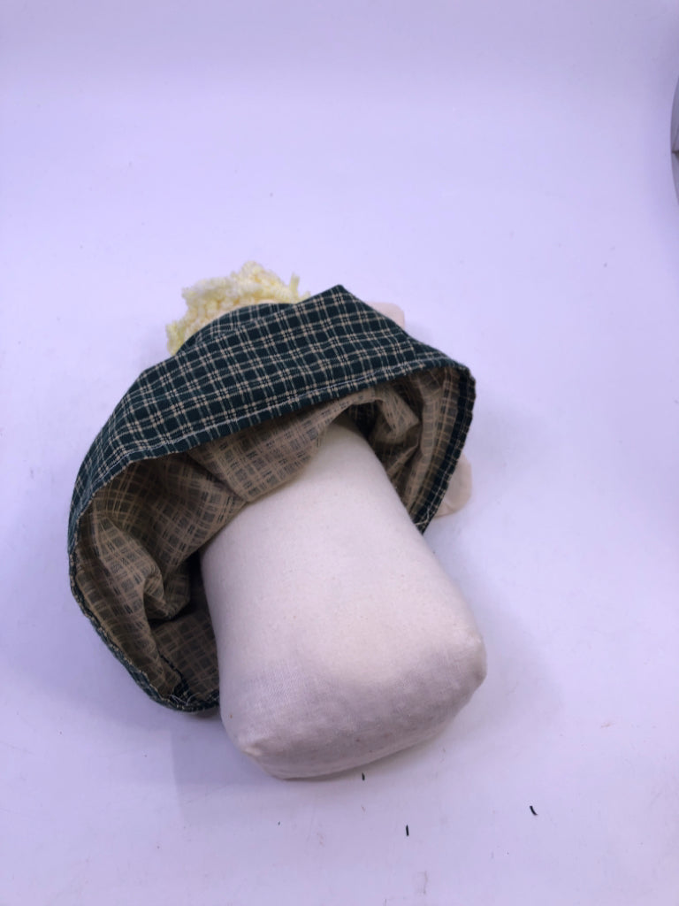 SOFT WHITE ANGEL IN GREEN FLANNEL DRESS.