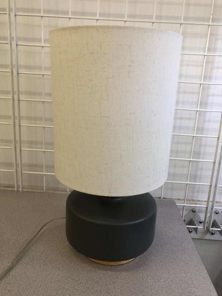 SMALL GRAY CERAMIC LAMP W/WOOD BASE + WHITE SHADE.