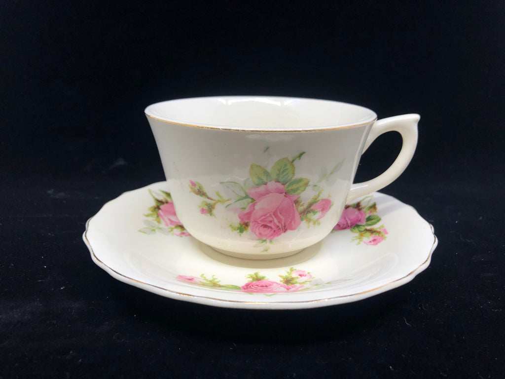 WHITE W PINK ROSES TEACUP AND SAUCER.