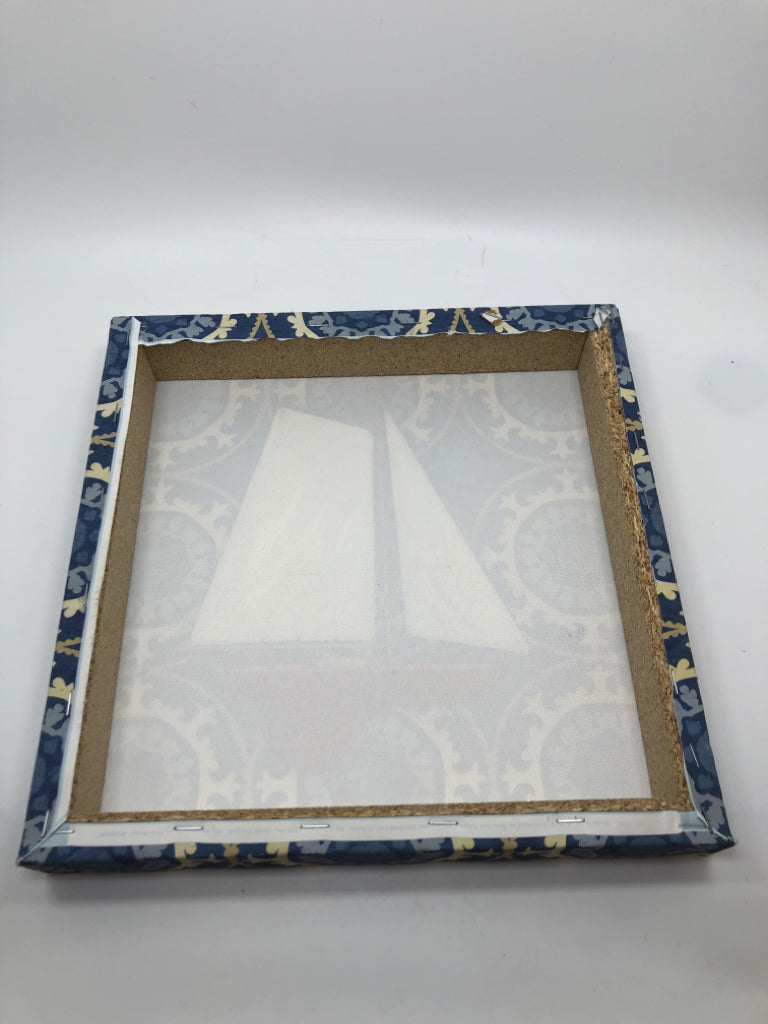 SAILBOAT PAINTED CANVAS ON BLUE BACKGROUND.