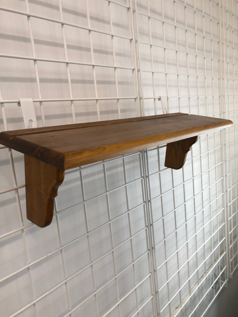 SHORT WOODEN WALL SHELF.