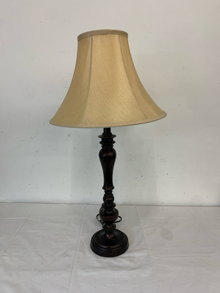 SKINNY BROWN BASE LAMP W TAN SHADE.