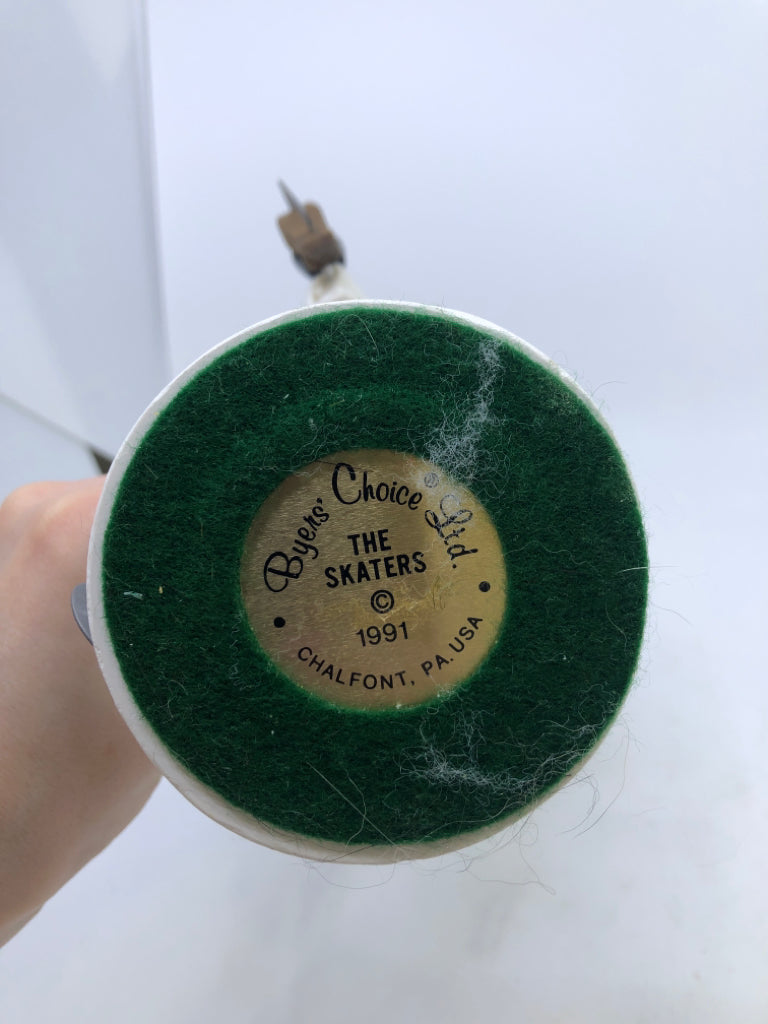 MAN IN GREY COAT W/BLUE & WHITE PLAID SCARF "THE SKATERS" 1991 BYERS' CHOICE.