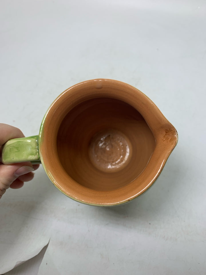 LIGHT GREEN TERRA COTTA SCRIPT PITCHER.
