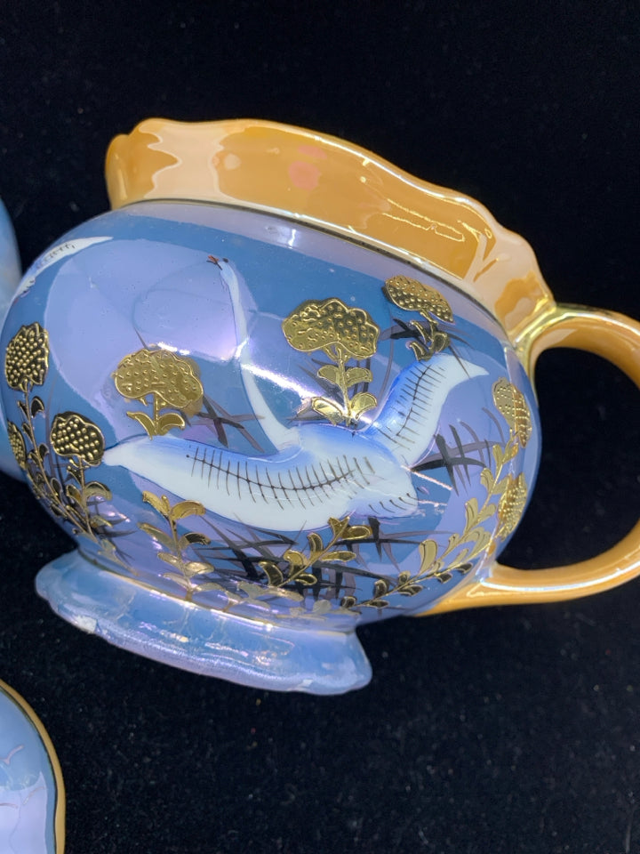 VTG TEAPOT PURPLE AND ORANGE W CRANE TEAPOT.