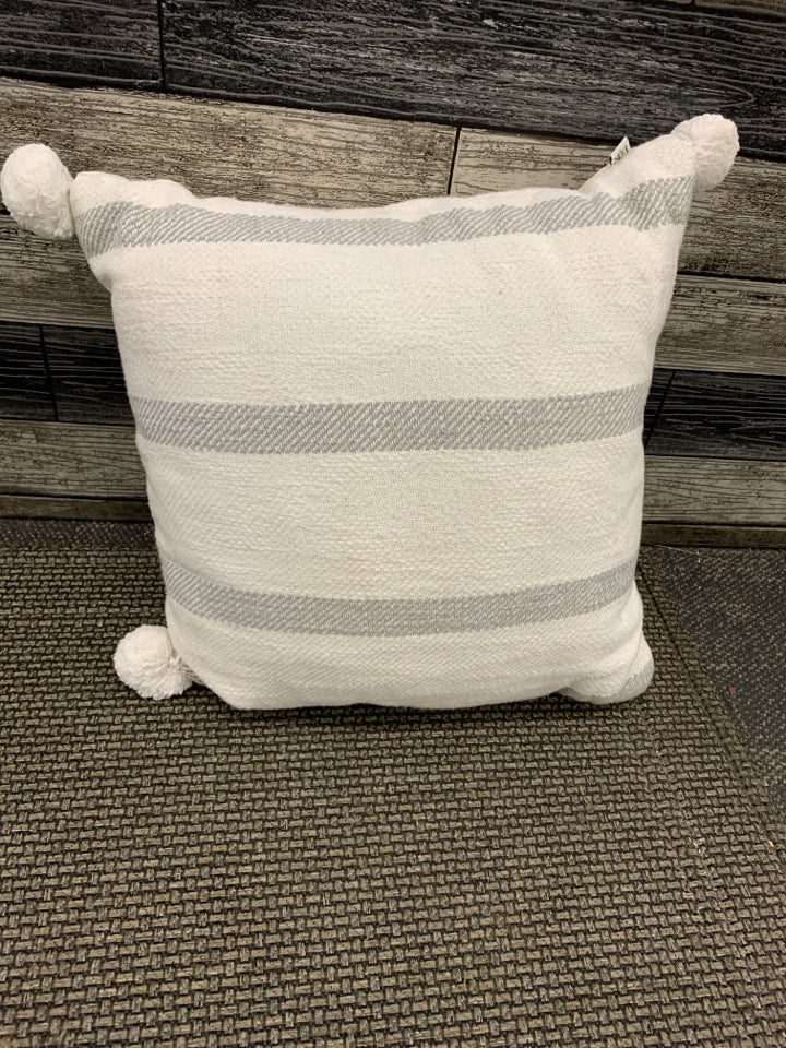 GREY STRIPED PILLOW W POMPOMS.