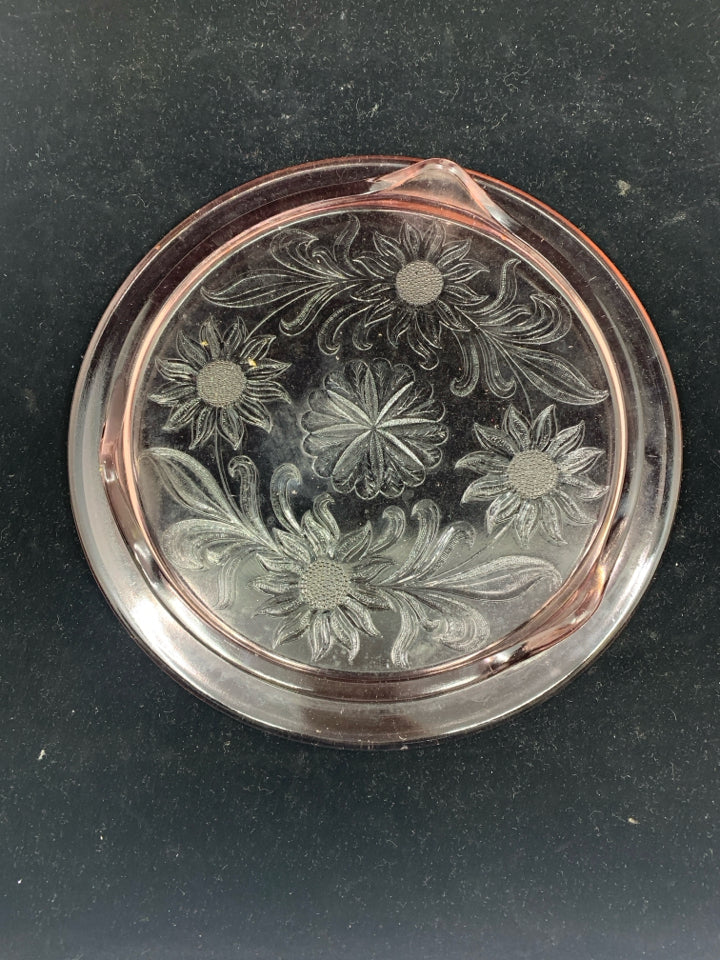 FOOTED PINK GLASS CIRCLE PLATTER W/ EMBOSSED FLOWERS.